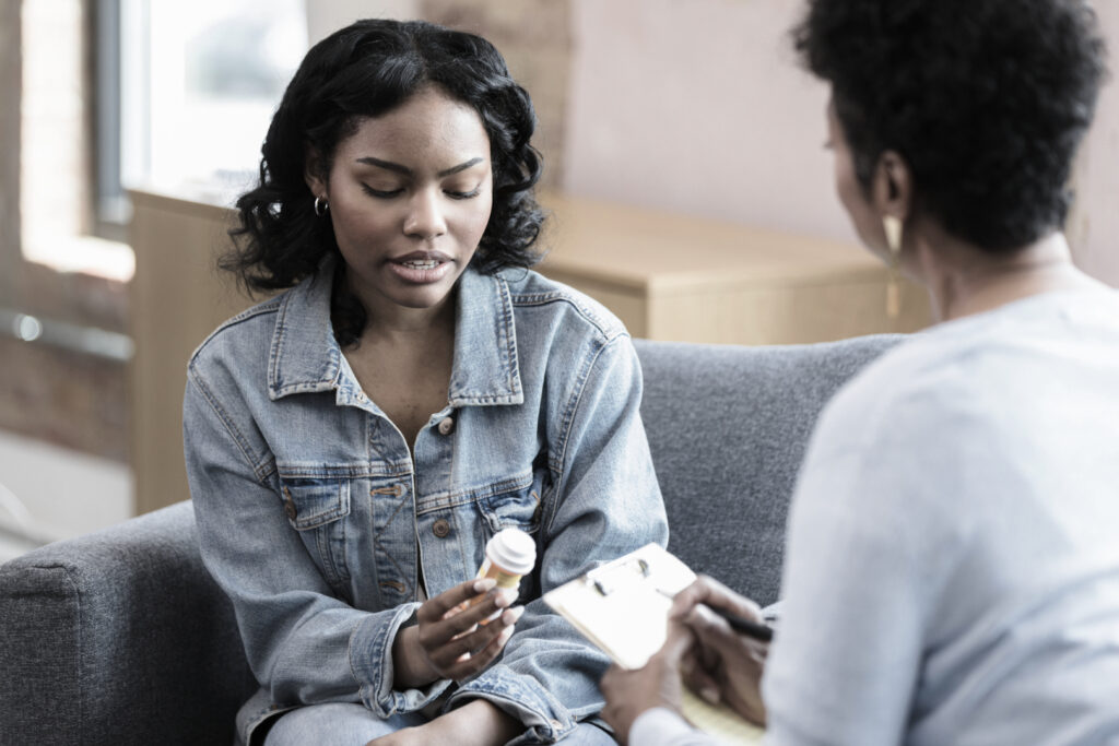 A woman receiving medication-assisted treatment (MAT) at Pillars Health Group.