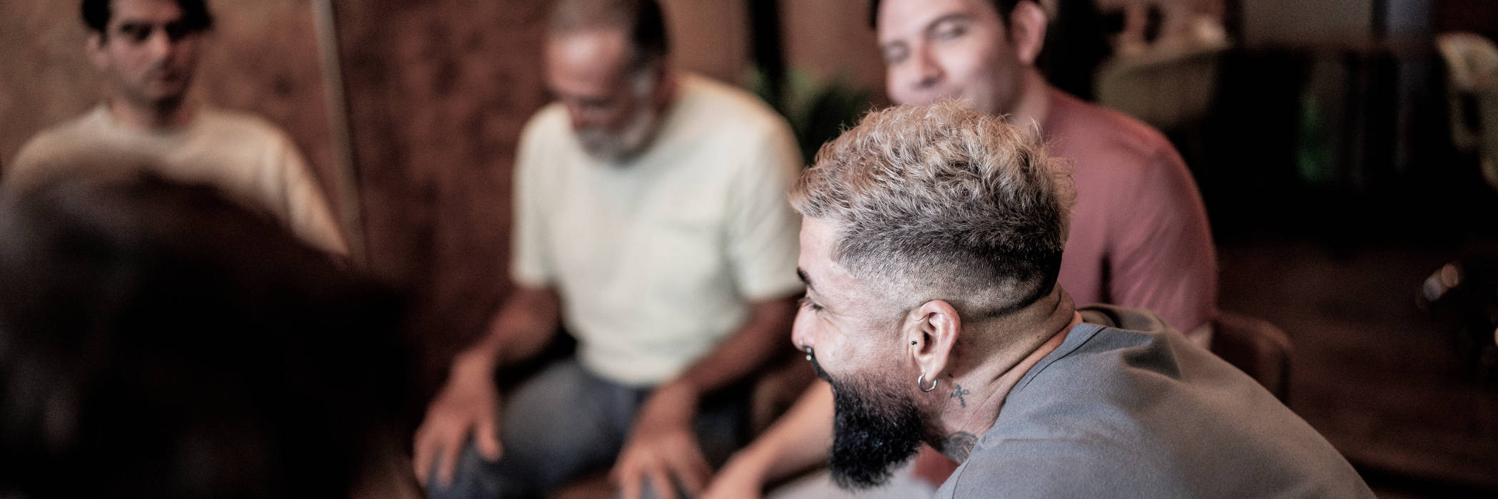 A man in a group therapy session for his anxiety and repressed trauma.