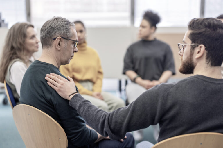 A man in group therapy for his opioid addiction treatment.