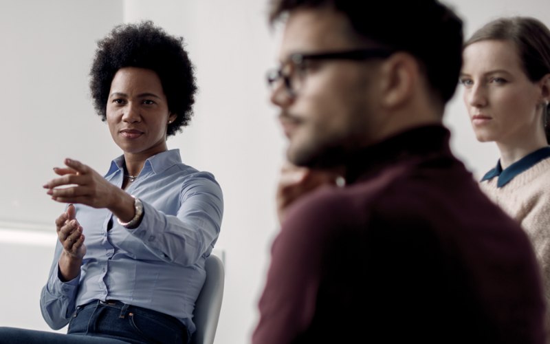 A Clinician Leads Group Therapy at Pillars Health Group