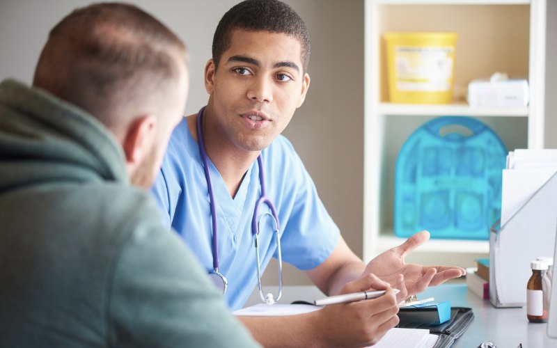 Dr. Discussing Detox with a client