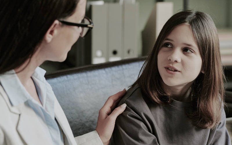A young girl in a therapy session during full-day outpatient treatment for teens in Concord, MA.