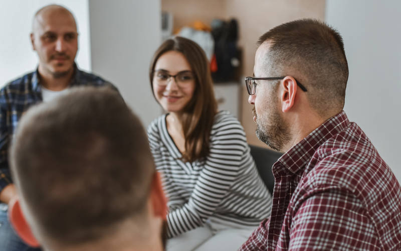 Men and women in a group therapy session for outpatient mental health treatment in Scarborough, ME. 