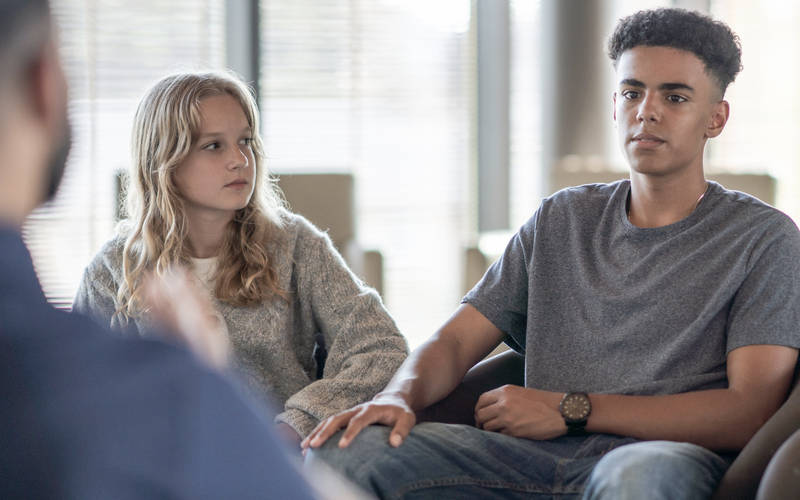 A group of young teens in a group therapy session for teen OCD treatment at Pillars Health Group in Concord, MA.