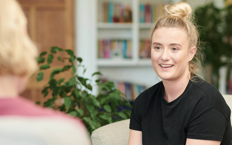 A young woman in an individual therapy session for teen OCD treatment at Pillars Health Group in Concord, MA.