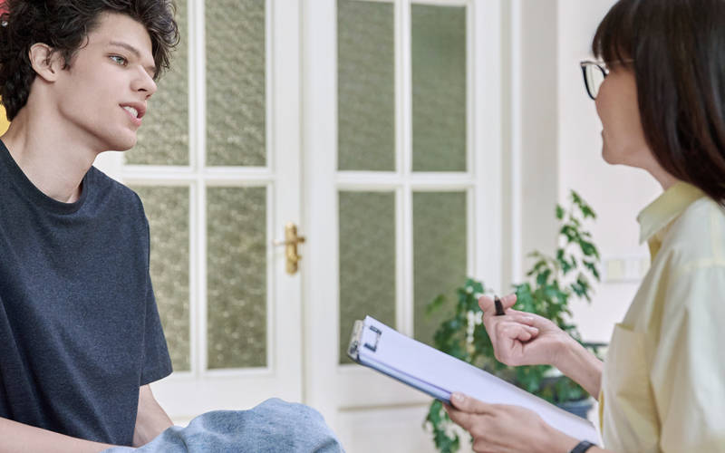 A young man in therapy for teen body dysmorphia treatment at Pillars Health Group in Concord, MA.