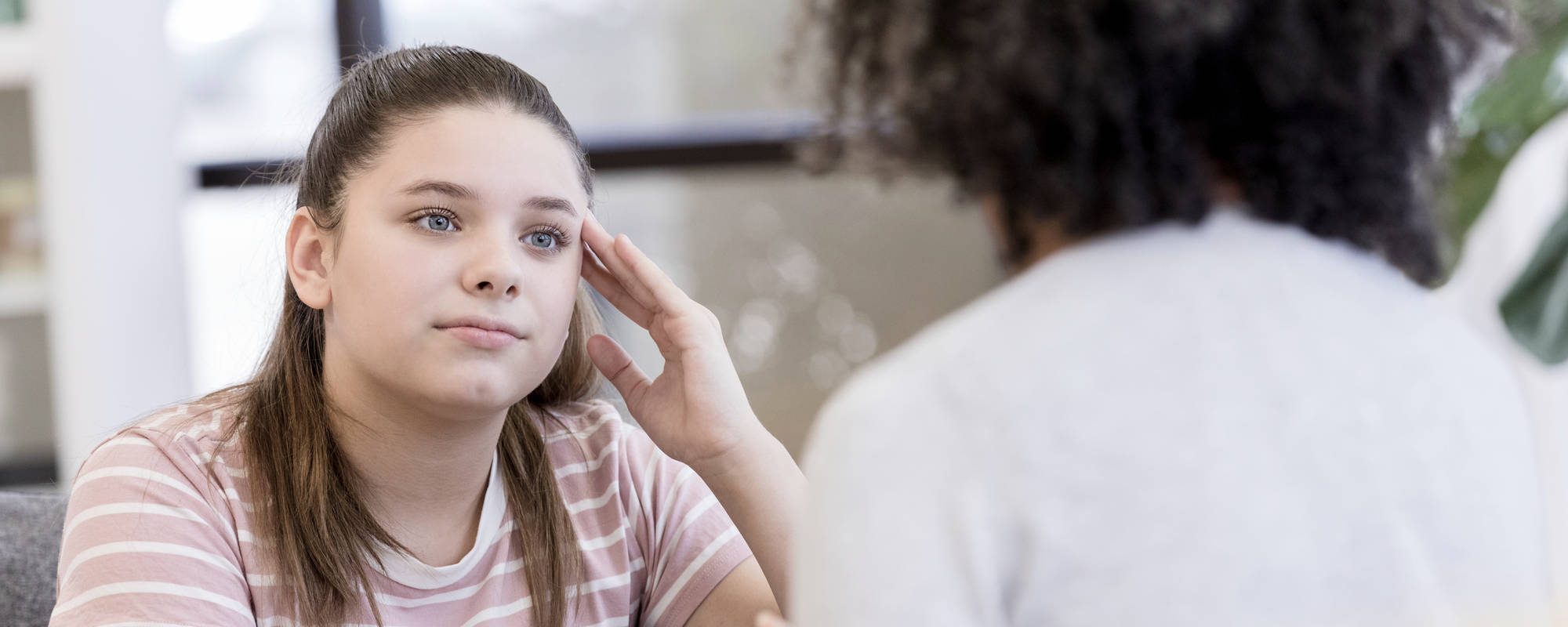 A young girl in an individual therapy session for teen anxiety disorder at Pillars Health Group's adolescent mental health center in Concord, MA.