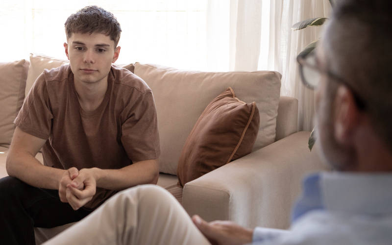 A teenage boy in therapy for teen personality disorder treatment at Pillars Health Group in Concord, MA.