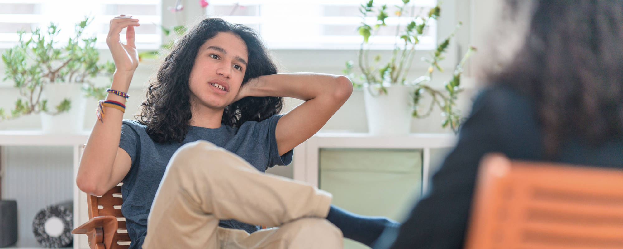 A young man in a therapy session for teen personality disorder treatment at Pillars Health Group in Concord, MA.