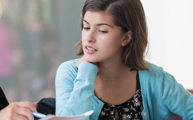 A teenage girl in therapy for teen self harm treatment/suicidal ideation at Pillars Health Group in Concord, MA.