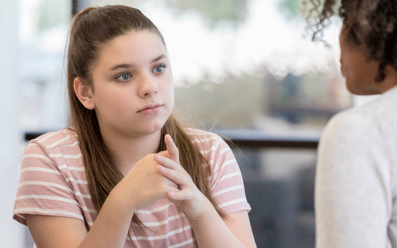 A young girl in individual therapy for teen ADHD treatment at Pillars Health Group's teen-focused treatment center in Concord, MA.