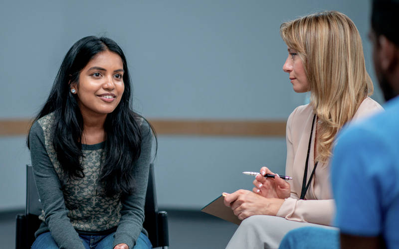 A young girl in group therapy for teen PTSD treatment at Pillars Health Group's teen-focused treatment center in Concord, MA.