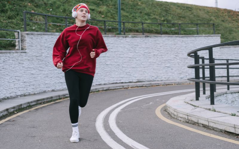 A teen running outside and learning how to rebuild their motivation after a mental health crisis.