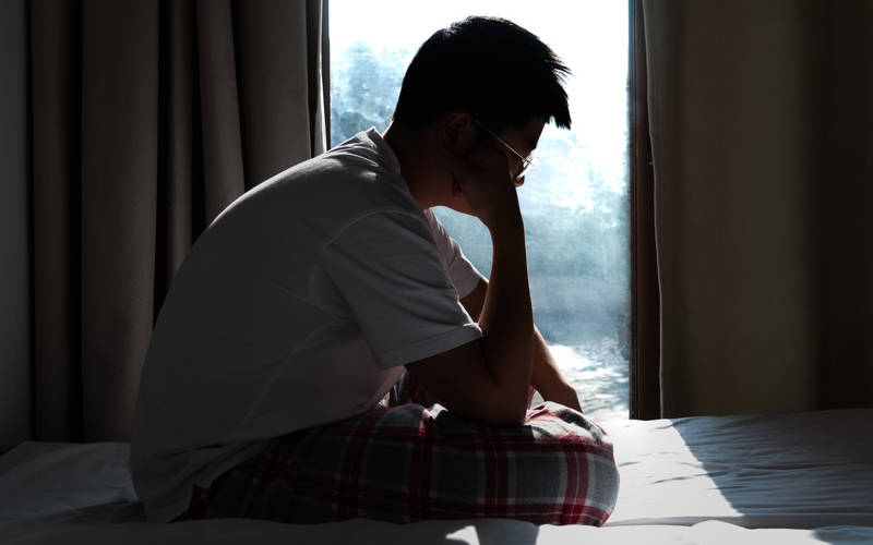 A young man learning about the differences between teen depression and adult depression.