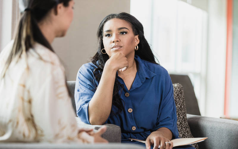 A woman in an individual therapy session for addiction and mental health treatment in Pepperell, Massachusetts.