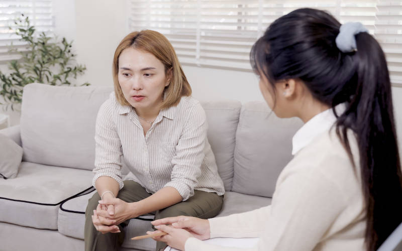 A woman in therapy for addiction and mental health treatment in Pepperell, Massachusetts.