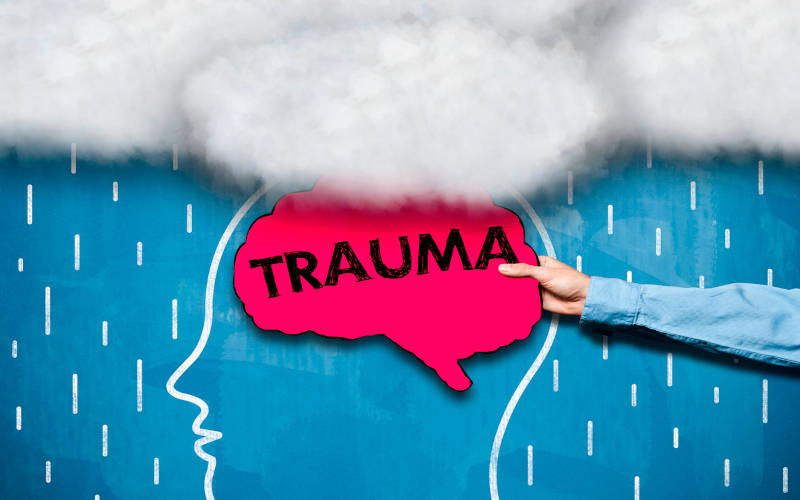 A drawing of a person with trauma, the cover image for the article "Trauma's Impact on Mental Health."