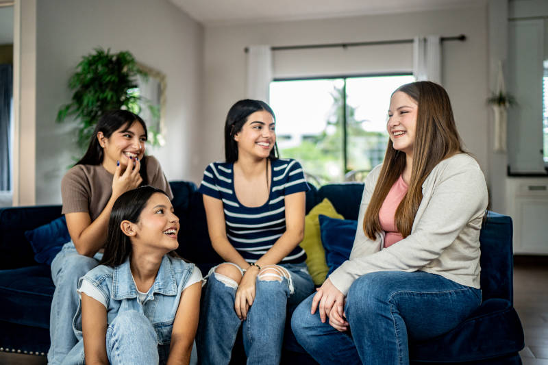 A group of teens learning healthy coping skills together.