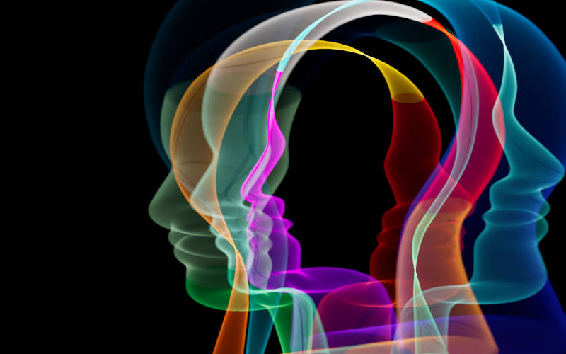A vector image of multiple heads, portraying personality disorders.