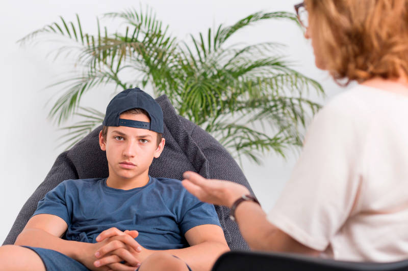 A young male teen learning about oppositional defiance disorder (ODD).