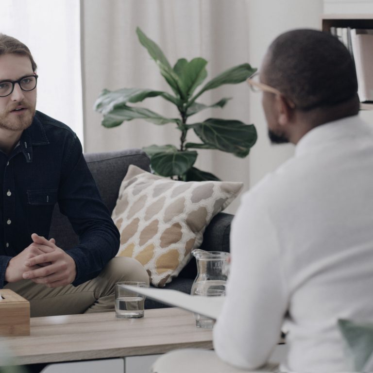 A man in a therapist setting at Pillars Health Group.