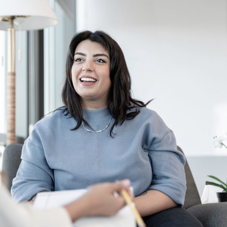 A woman in outpatient individual therapy at Pillars Health Group.